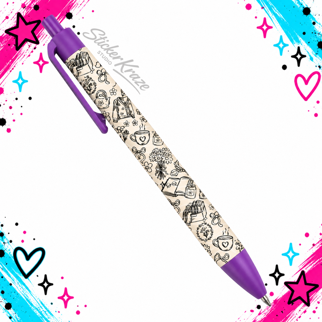 Cozy Chapters Pen with cream and black book, coffee, floral and cardigan pattern on a purple click pen